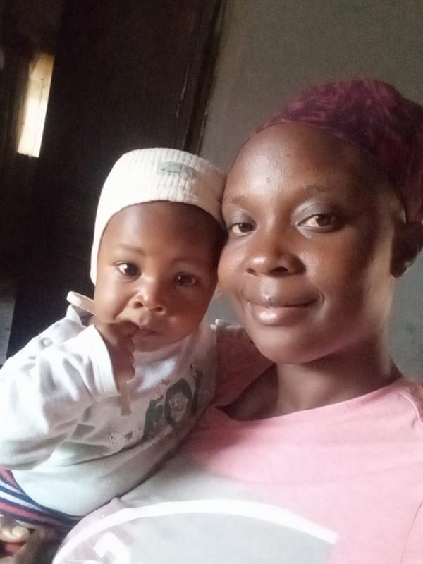 Woman and baby share tender moment in Sabon Tasha