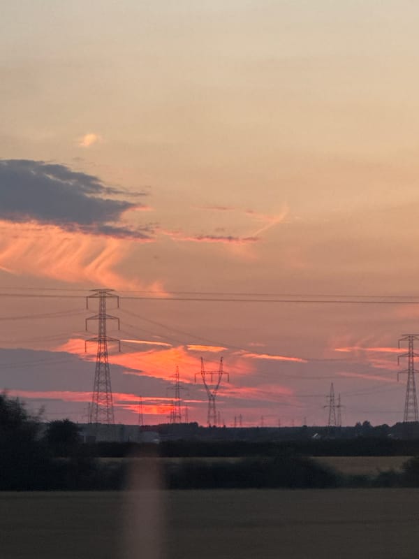 Sunset over Poznań's countryside, seen from a moving train