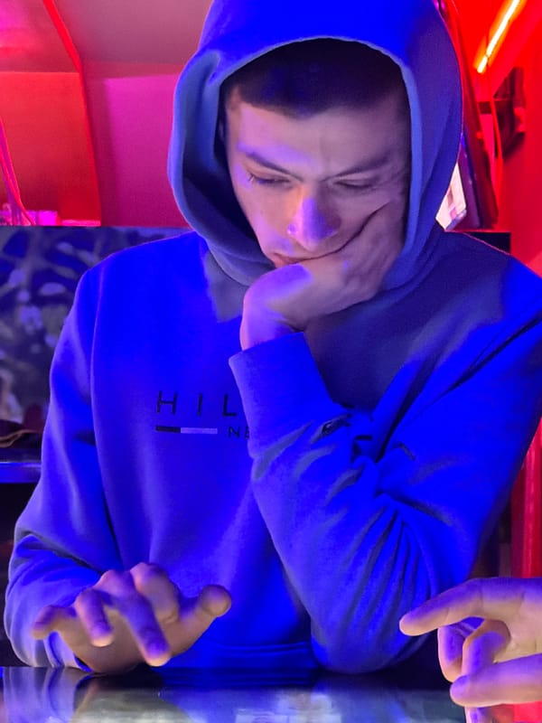 Person in blue hoodie photographed in Meknes, Morocco