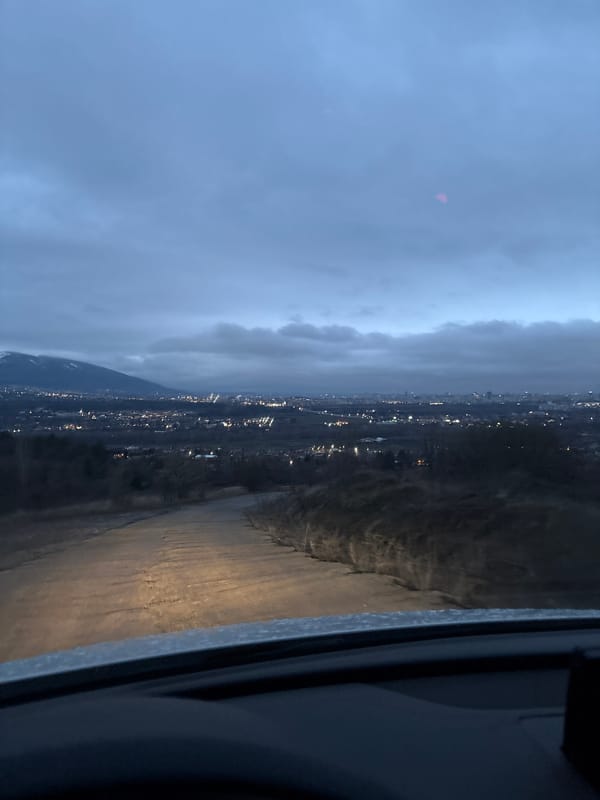 Nighttime cityscape photographed from vehicle interior in Bulgaria