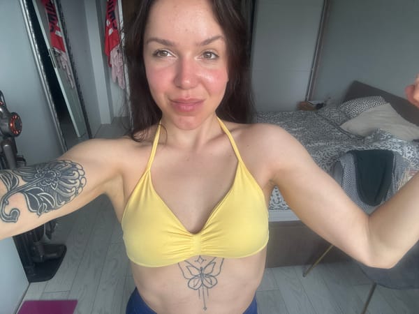 Woman takes selfies in bedroom in Burgas, Bulgaria