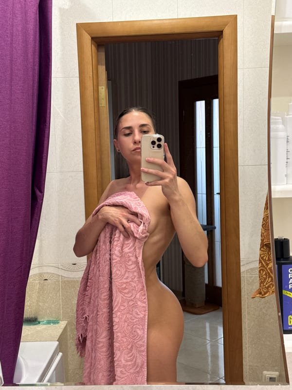 Woman takes towel-wrapped bathroom selfie in Russia