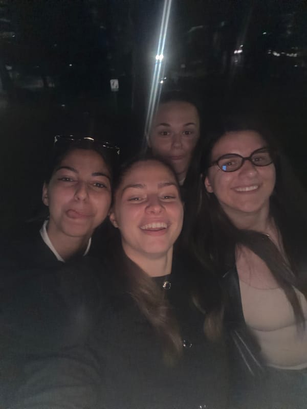 Four women take nighttime selfie in Etropole park