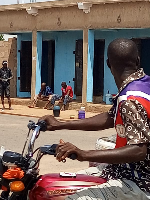 Daily street life moving through Tempure, Nigeria