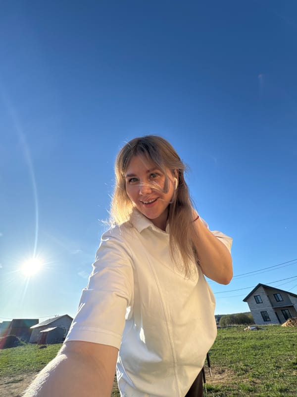 Woman takes selfies during sunny day in Ферма, Russia