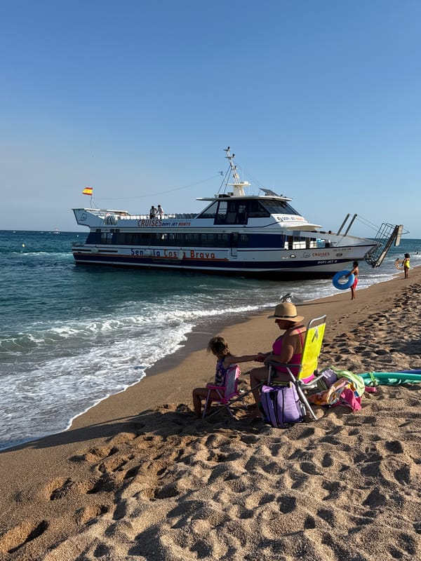 Lazy afternoon on the Blanes waterfront with a docked cruise boat