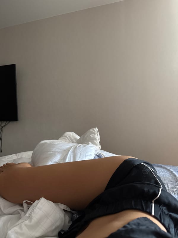 Morning bedroom moments with person and Bengal cat documented