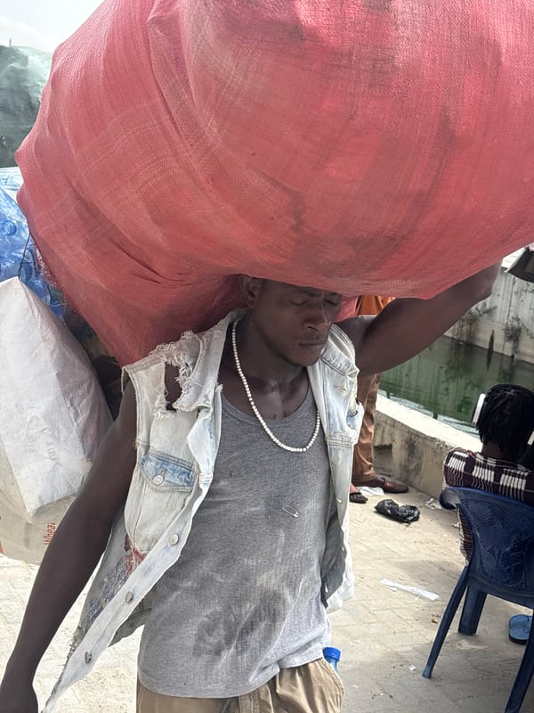 Daily life captured on Igboefon streets: fish vendor, cyclist