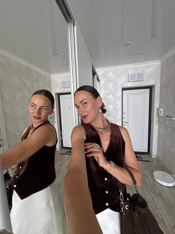Mirror selfie session at a Sochi apartment, outfit ready to go