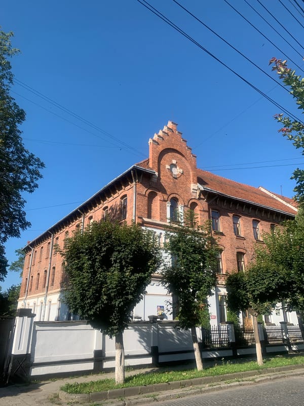 Kolomyia's brick churches and cathedral on a clear summer morning