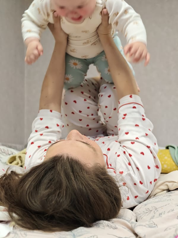 Mother and baby share playful morning moment in Chaikovsky