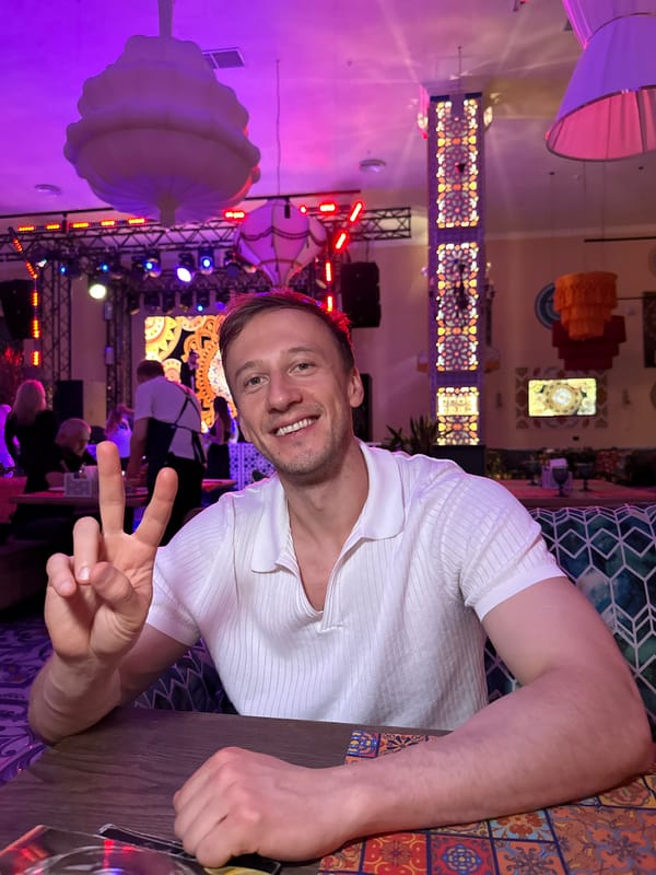 Peace signs at a wooden table in Sinyavino, Russia