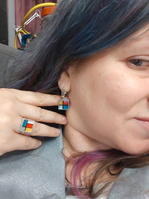 Woman in Mondrian jewelry photographed in Russian interior setting