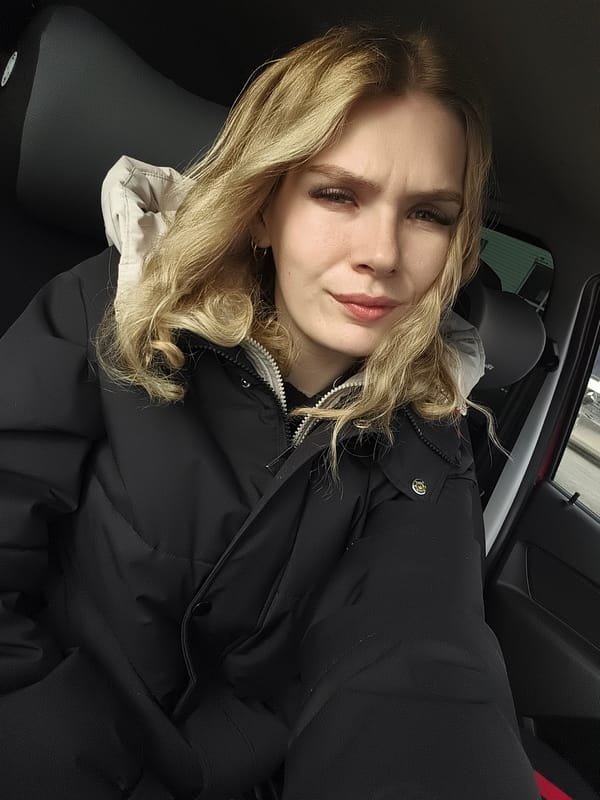 Portrait of pensive woman photographed inside car in Izhevsk