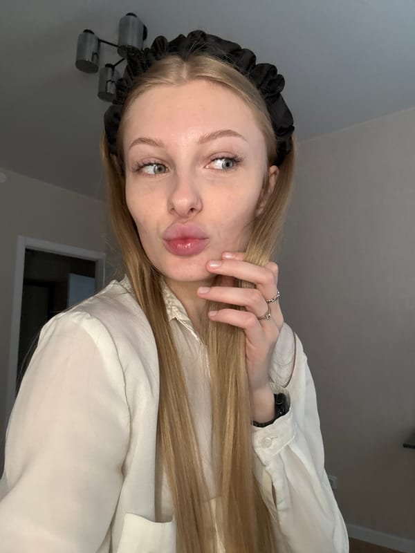 Woman takes selfies during rainy afternoon in Perm