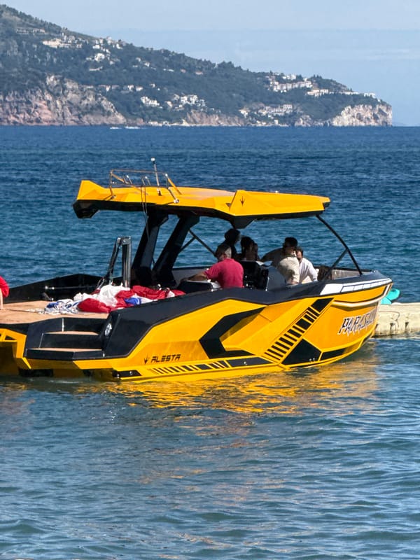 Budva's waterfront buzzes on a sunny summer afternoon