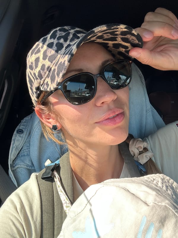 Woman photographed in vehicle on sunny Fethiye street