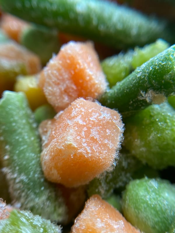 Frozen vegetables, frosted cookies, and a city street afternoon