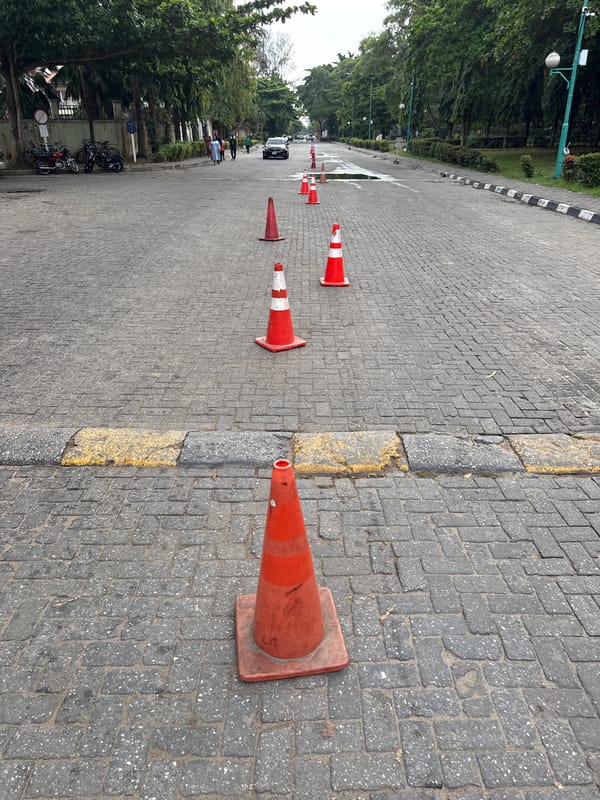 Street scene documented in Lekki showing paved road with cones
