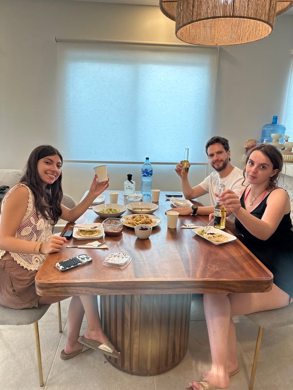 Friends share traditional Mexican meal with chapulines in Zicatela
