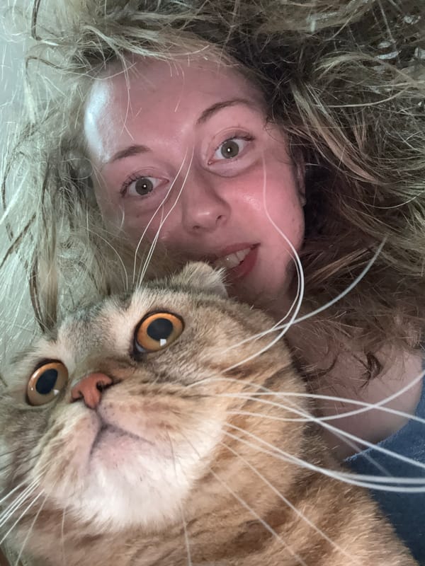 Woman captures intimate moments with cat in extended selfie session