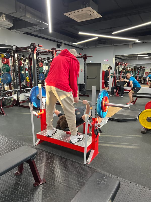 Two men spotted exercising at Khimki gym