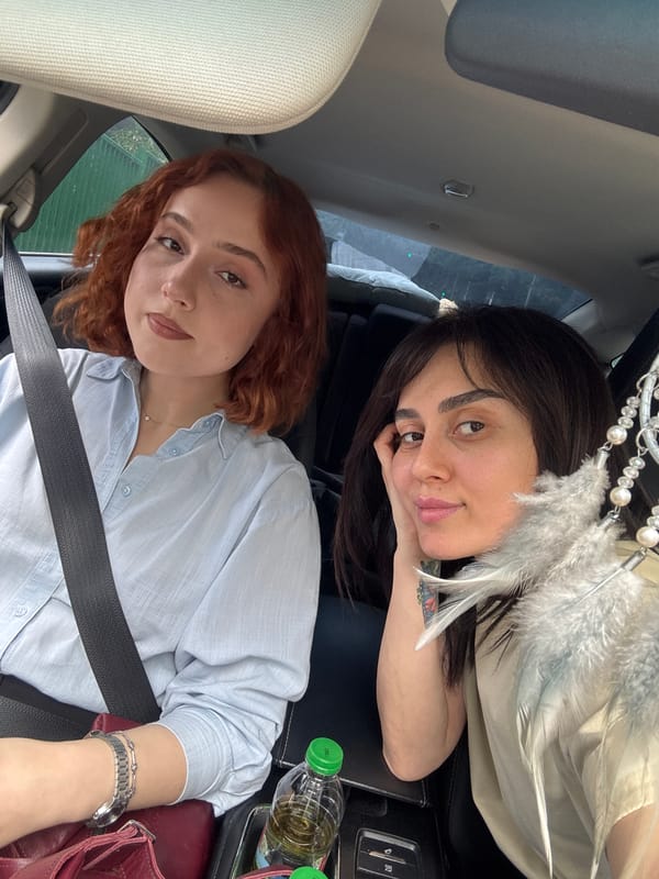 Two women take car selfies in Tbilisi