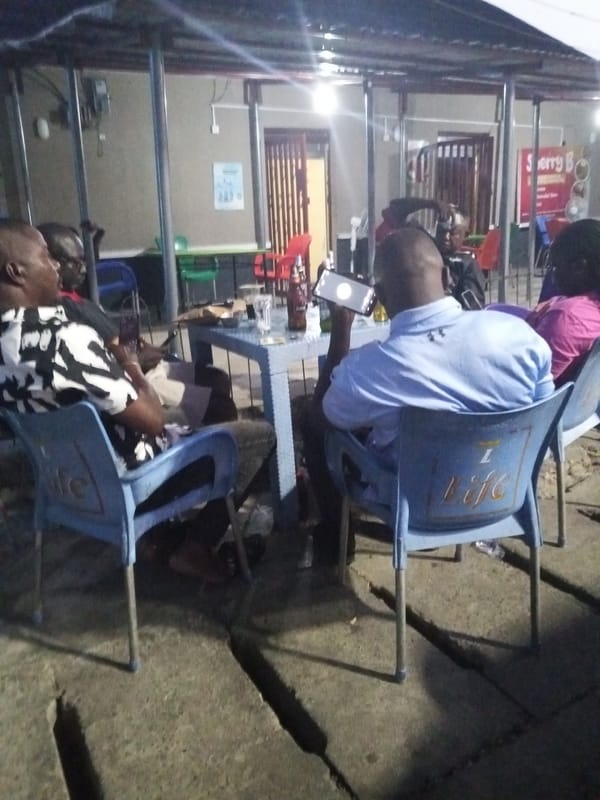 Evening social gathering at outdoor bar in Lokoja, Nigeria