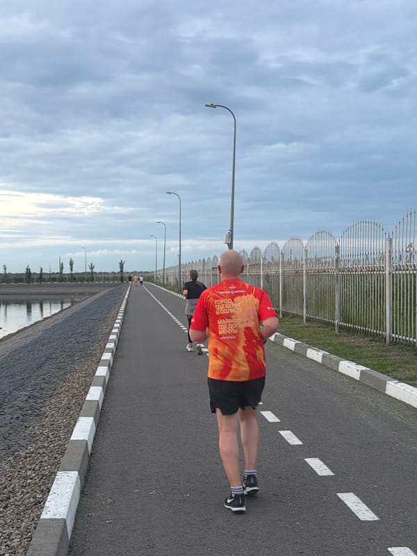 Cyclist rides waterfront road in Bataysk, Russia