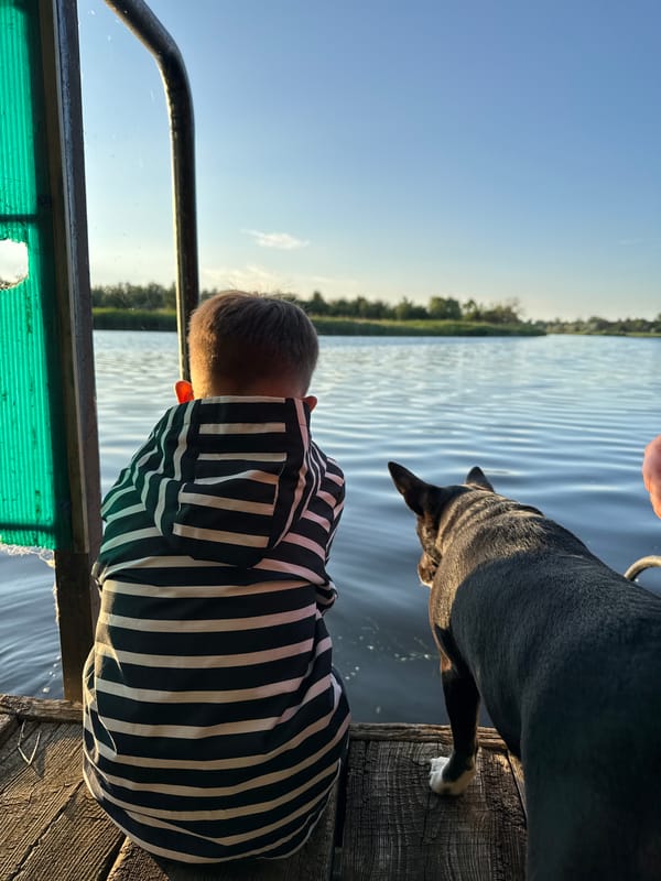 Evening waterfront hangout with friends, dog, and glow sticks in Lozuvatka