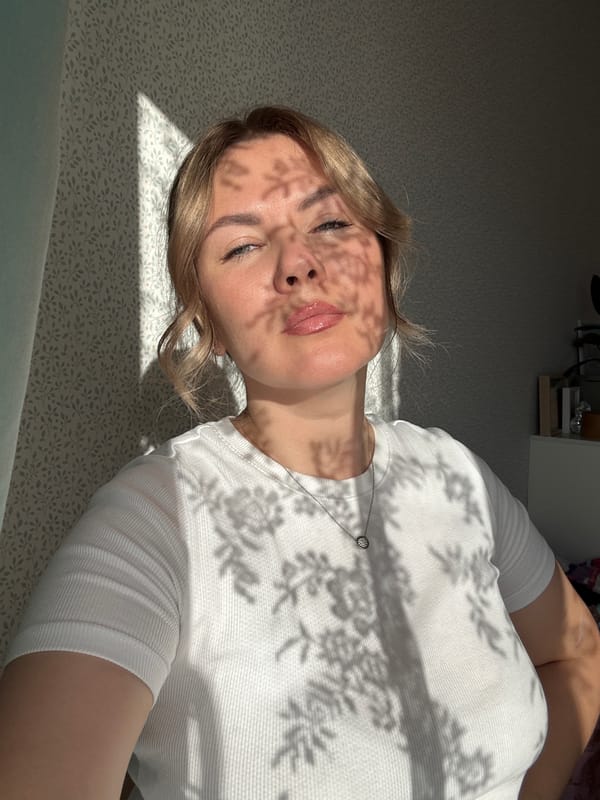 Woman rests in sunlit room in Izhevsk