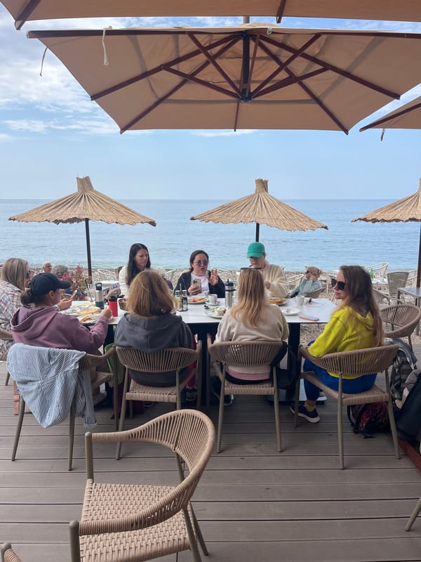 Women gather for morning meal at beachside restaurant