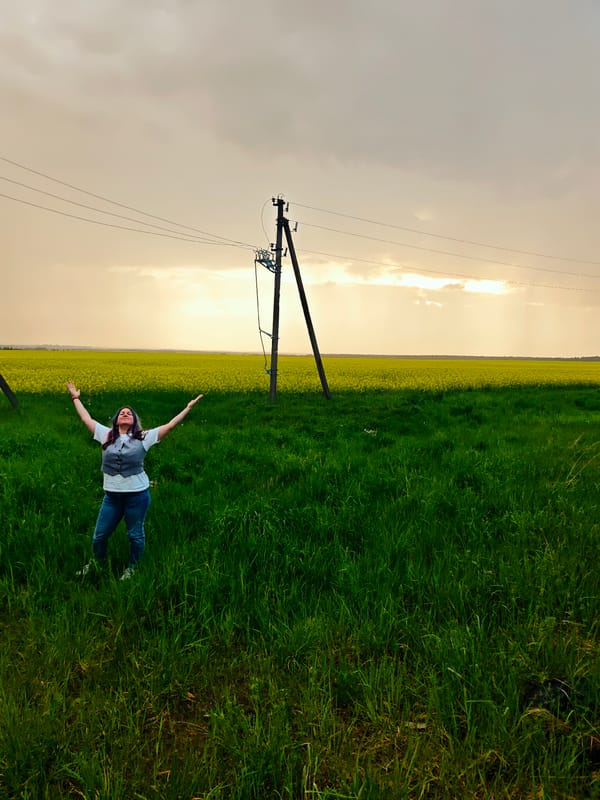 Woman photographed in Russian countryside near utility infrastructure