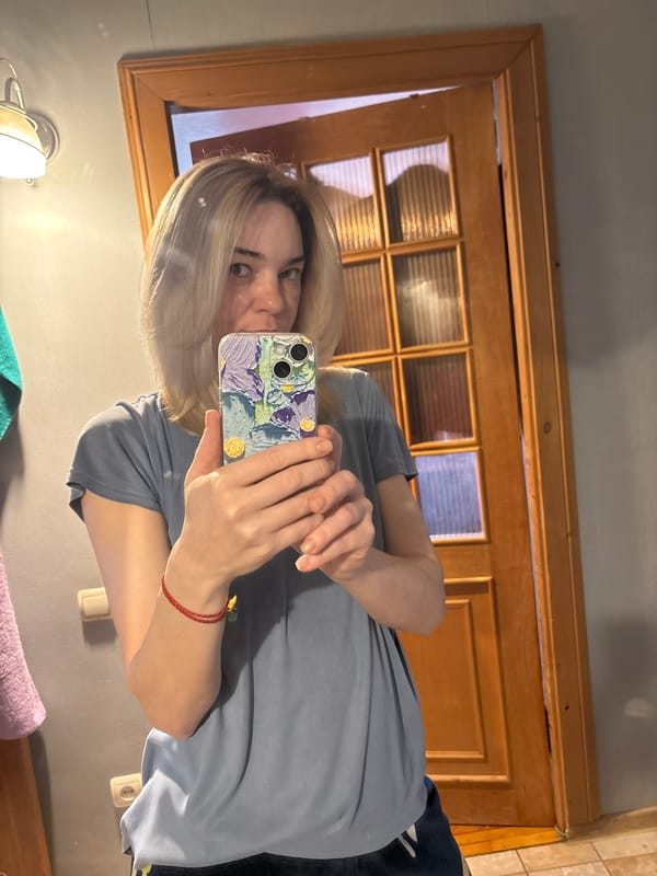 Woman Takes Multiple Selfies While Adjusting Hair Indoors
