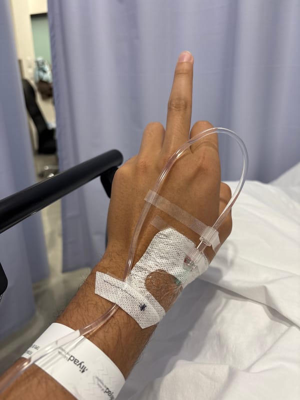 Hospital patient in León makes cheerful gestures during IV treatment