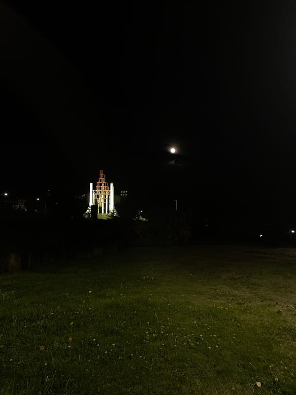 Illuminated geometric sculpture observed during Ushuaia night scene