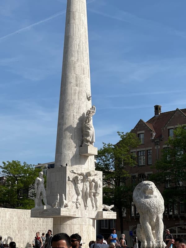 Tourist documents afternoon walk through Amsterdam's Dam Square area