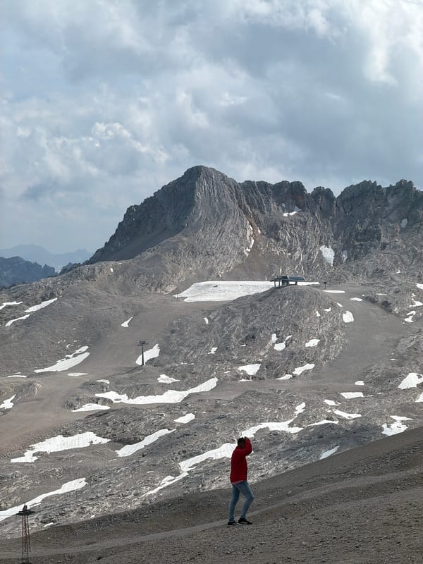 Snow groomers and summer snow on a Garmisch mountain slope