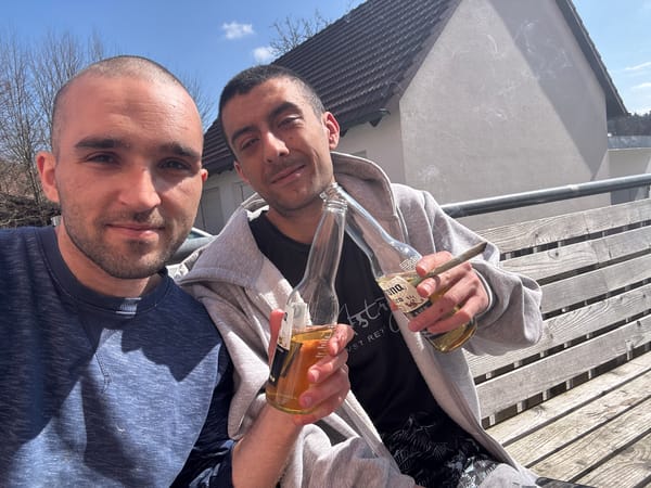Two men take selfie with beer bottle in Wolfsegg
