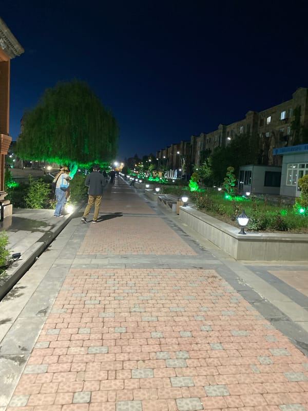 Night view of a lit pedestrian walkway in Gyumri, Armenia
