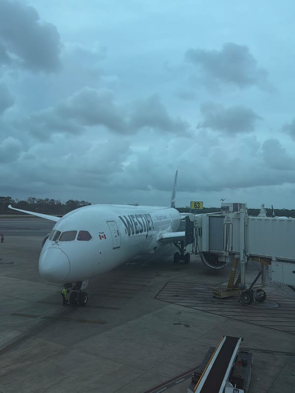 WestJet Boeing 787 parked at Cancún Airport gate
