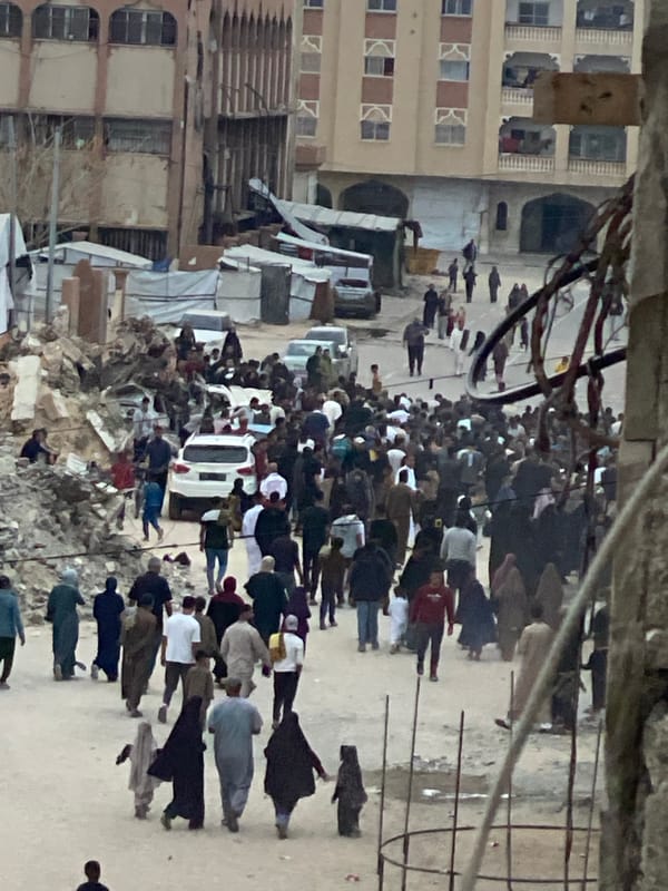 Crowds gather amid debris in Khan Yunis streets