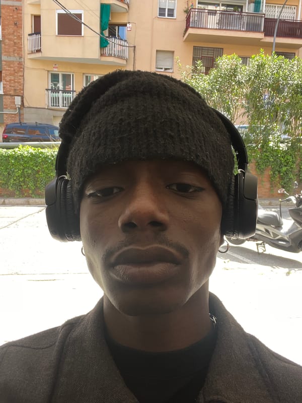 Person in headphones photographed multiple times in Barcelona