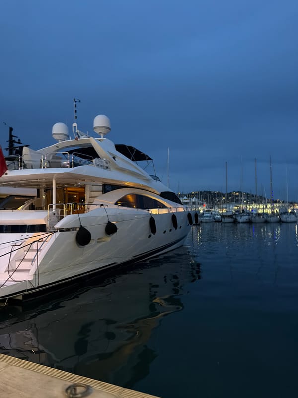 Luxury yachts captured at twilight in Cannes marina