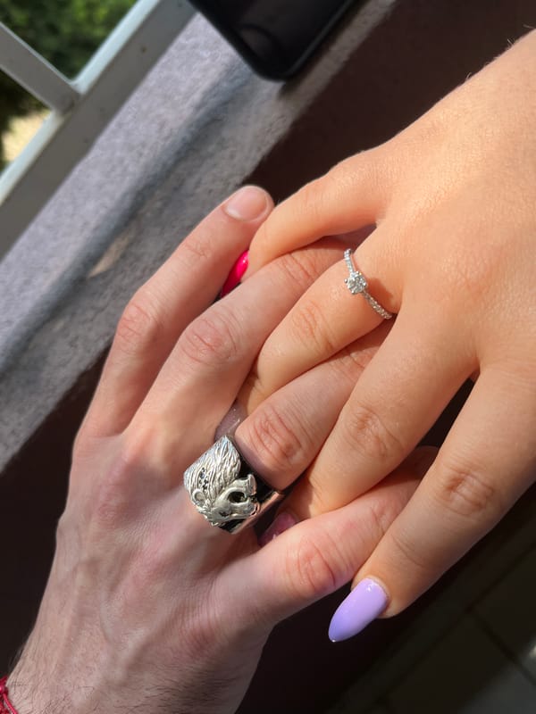 Hands, rings, and a TEILOR engagement box in Sofia