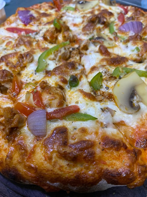 Evening street activity observed in busy Dhaka neighborhood