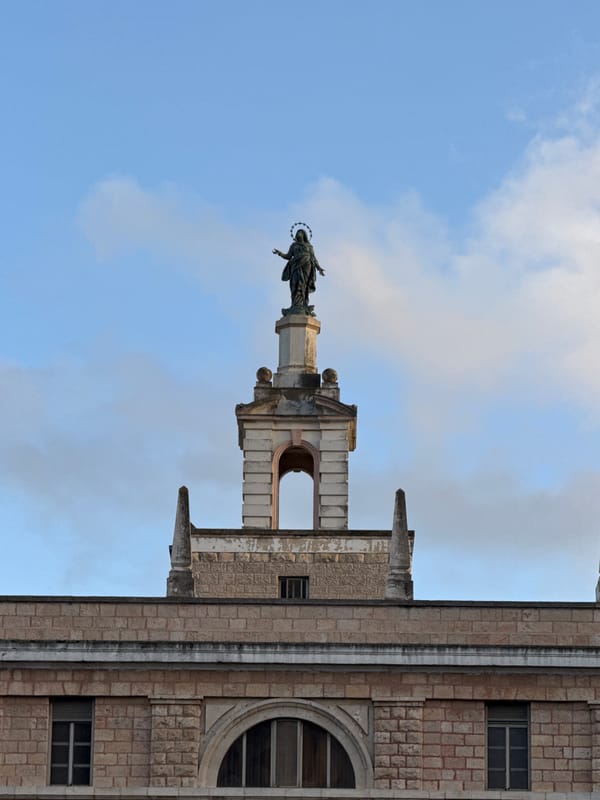 Stone building with haloed woman statue documented in Jerusalem