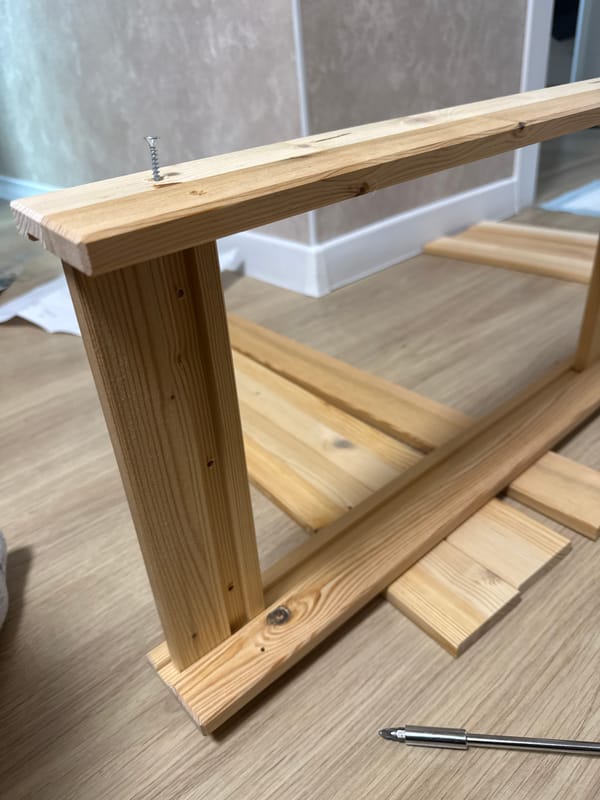 Wooden construction project in progress on indoor floor