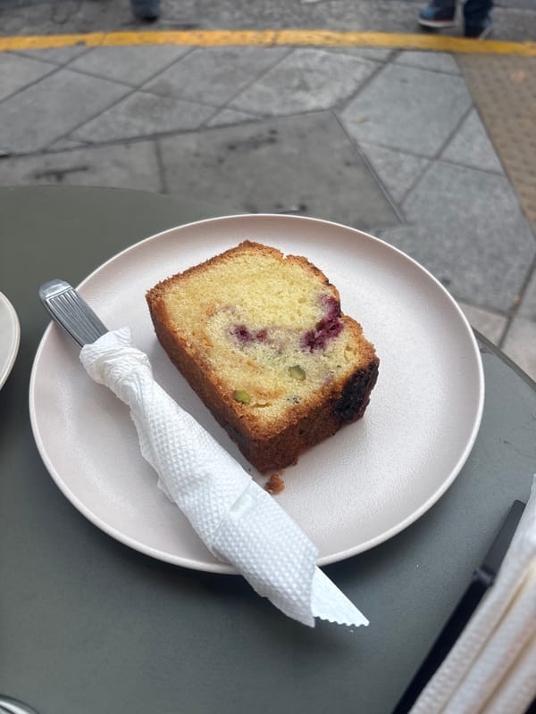 Cafe patron documents dessert and coffee in Buenos Aires