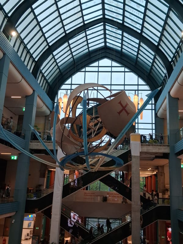 Shoppers observe maritime art installation at Lisbon mall